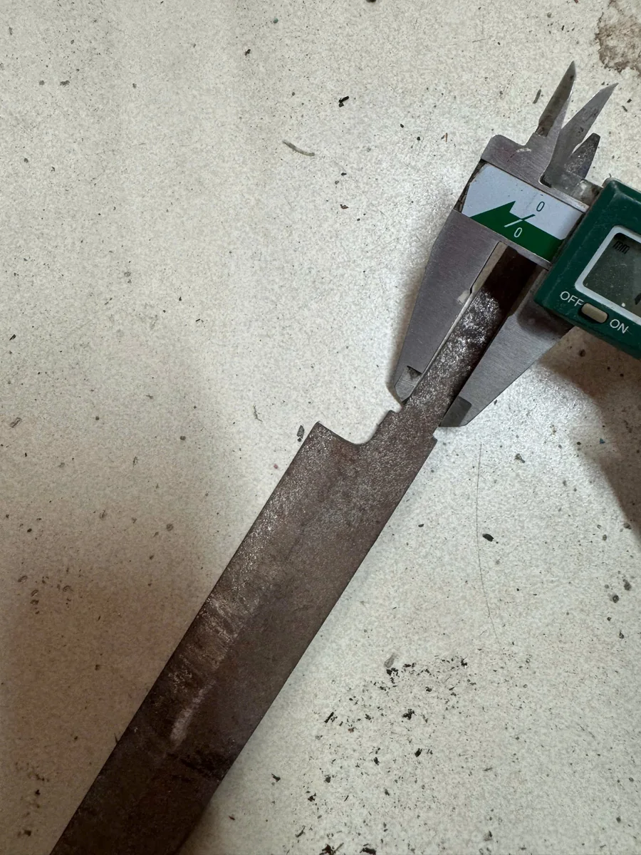 Caliper measuring an exposed tang