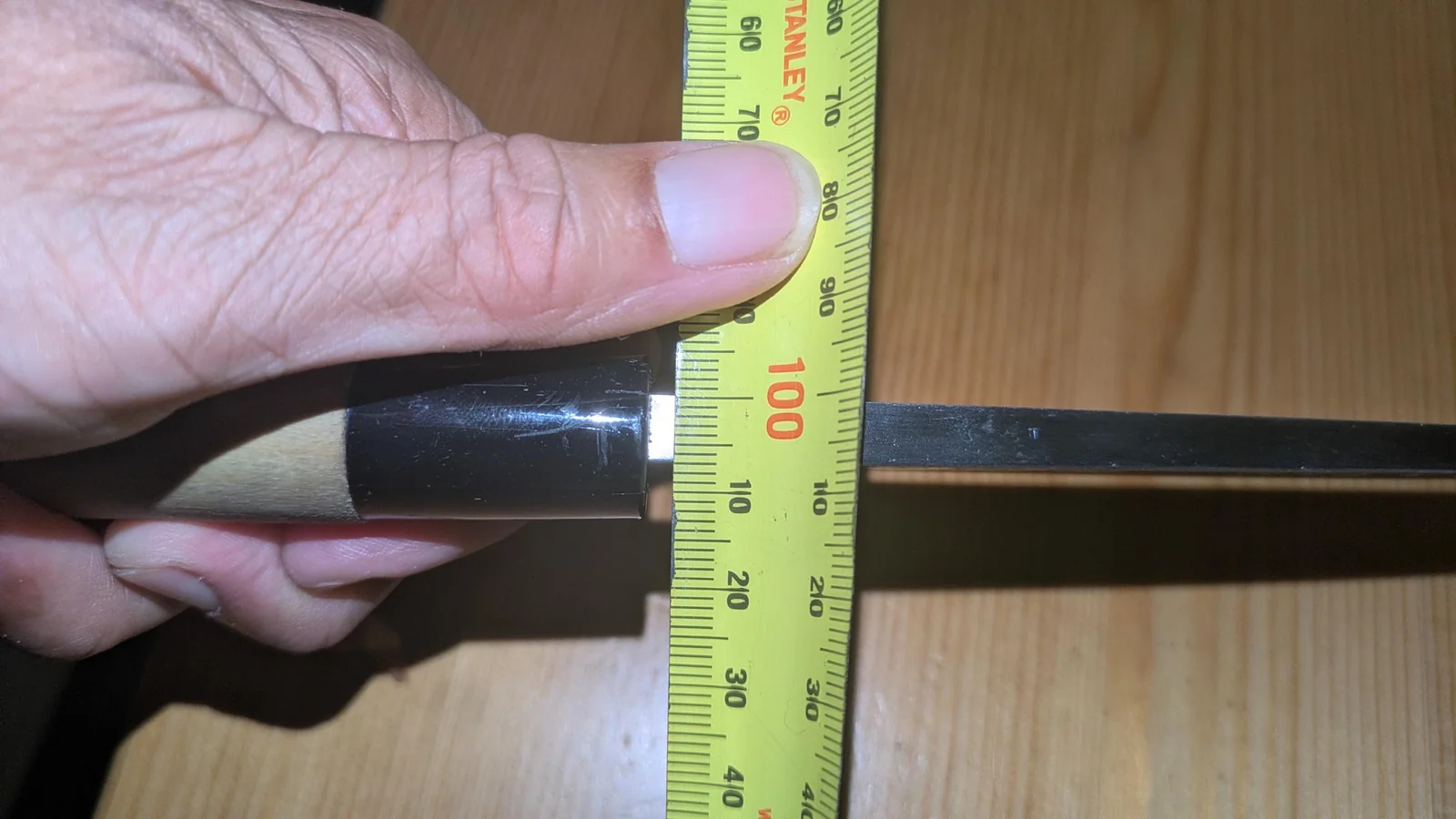 Tang thickness measured side to side at the machi