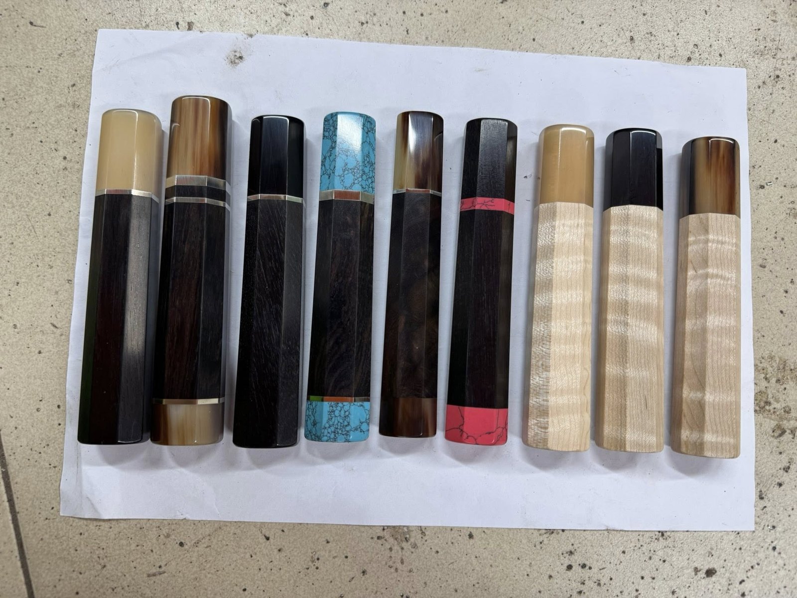 Collection of handcrafted wa handles in various premium woods with buffalo horn ferrules
