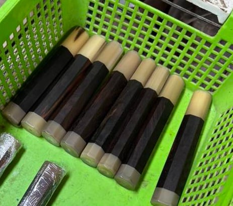 Finished wa handles with horn ferrules arranged in a workshop basket