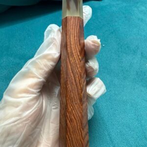 Bocote wa handle with buffalo horn ferrule, held in the workshop