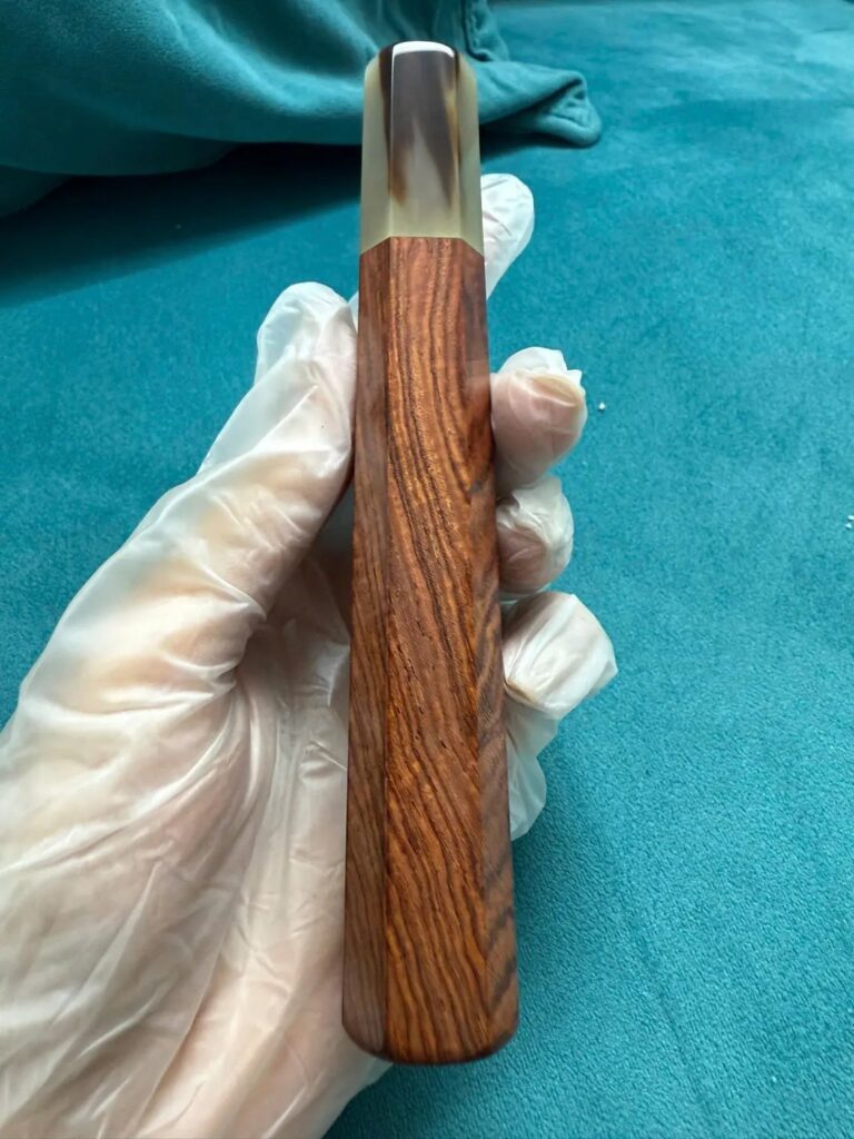 Bocote wa handle with buffalo horn ferrule, held in the workshop