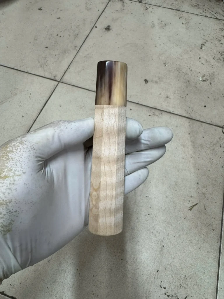 Curly maple wa handle with buffalo horn ferrule, photographed before shipping in September 2026