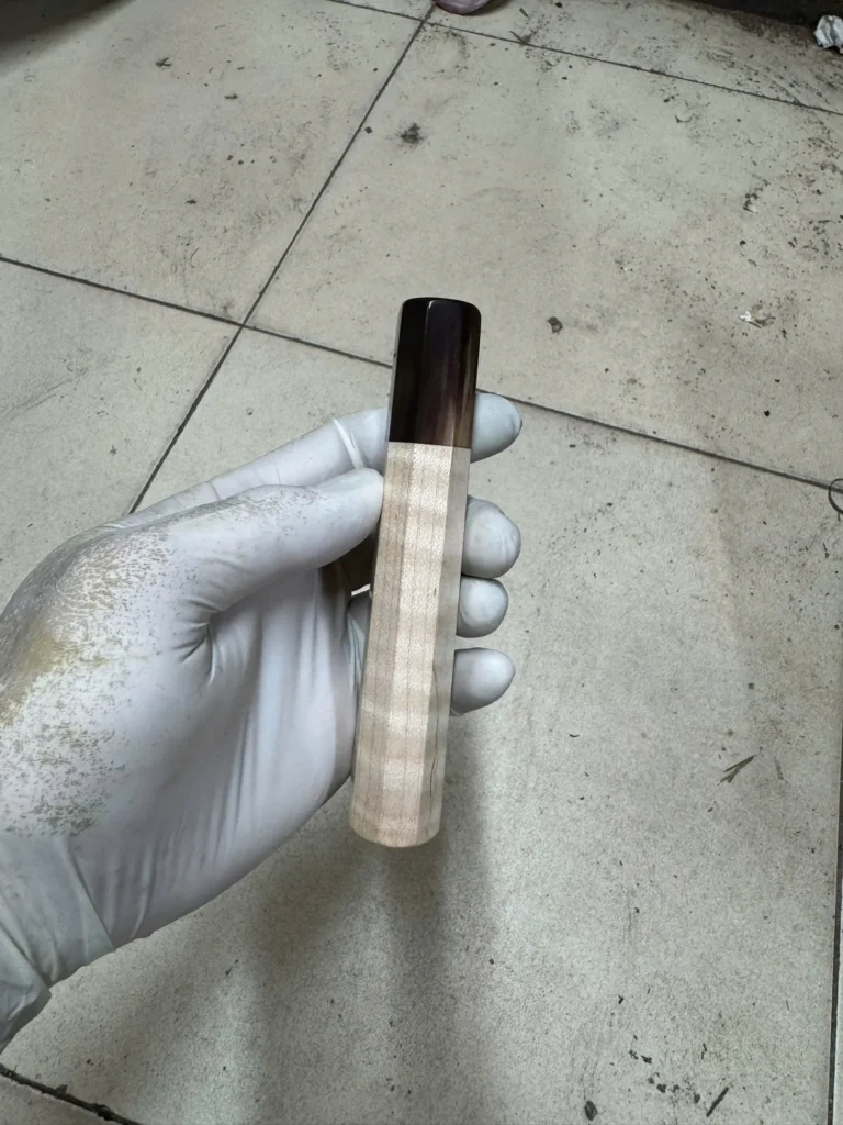 Curly maple wa handle with buffalo horn ferrule, photographed before shipping in September 2026