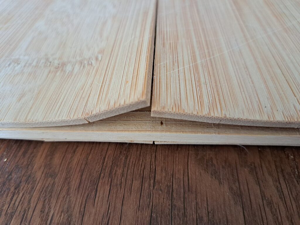 Close view of a split between the strips of a laminated cutting board.
