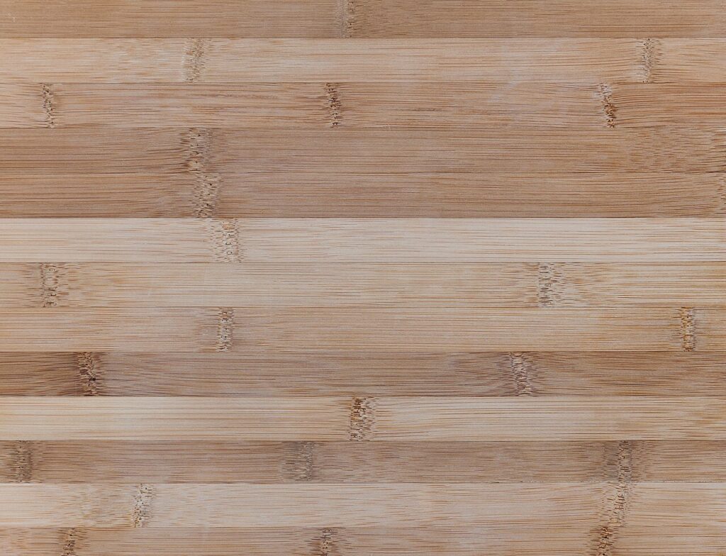 Close-up of the joined strips and fine fibres in a bamboo cutting board.