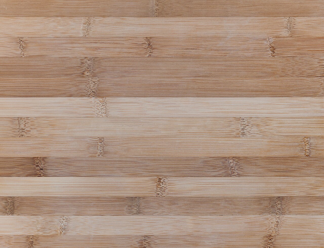 Close-up of the joined strips and fine fibres in a bamboo cutting board.