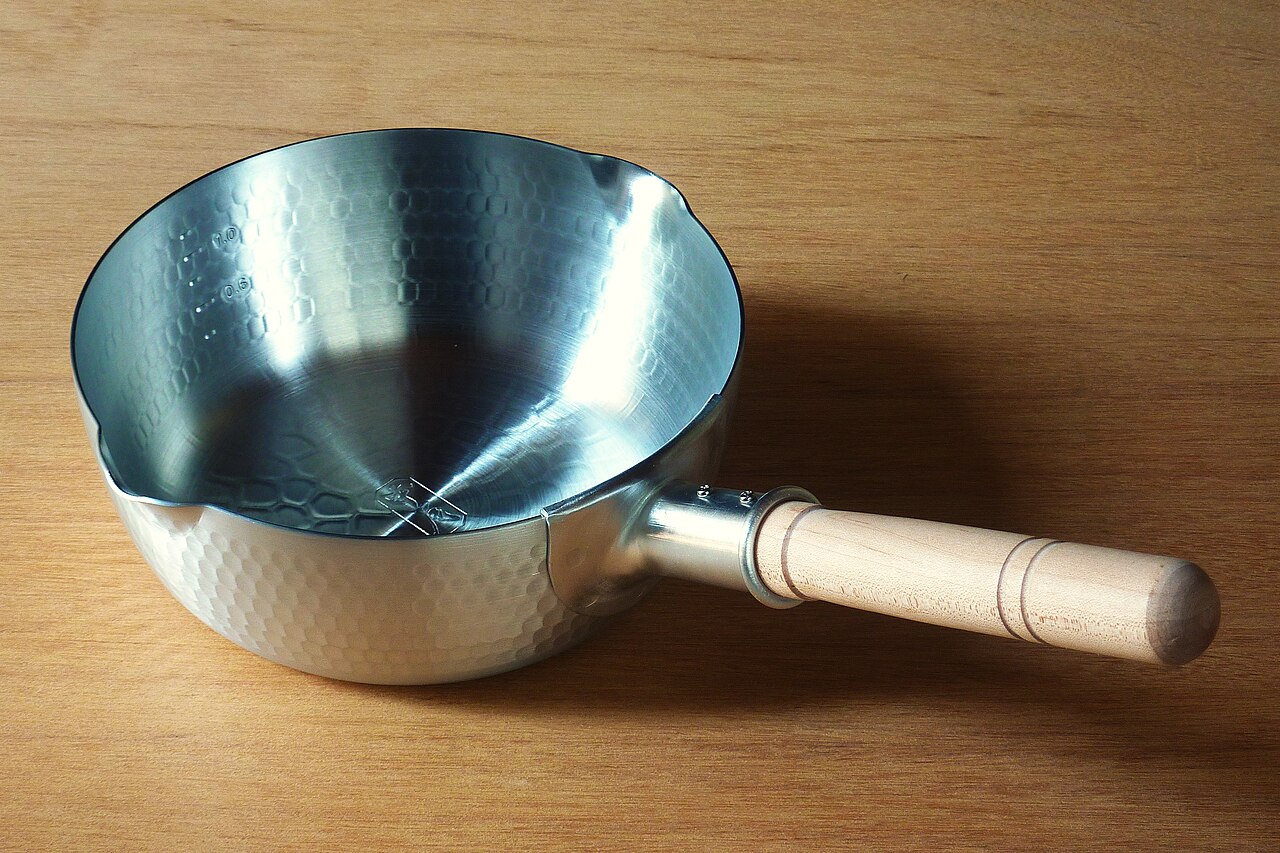 A Nakao yukihira saucepan with a permanently attached wooden handle.