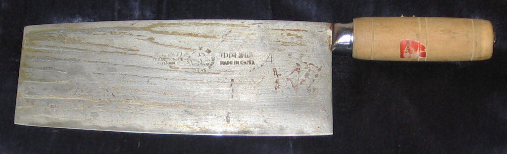 Chinese kitchen knife with a broad rectangular blade and wooden handle