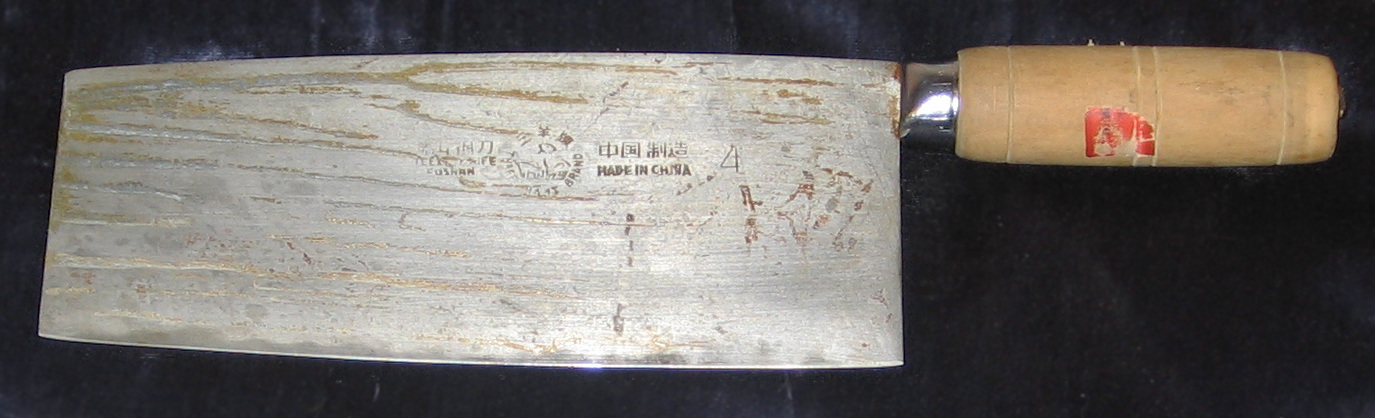 Chinese kitchen knife with a broad rectangular blade and wooden handle