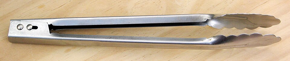 Stainless-steel kitchen tongs with scalloped gripping ends.