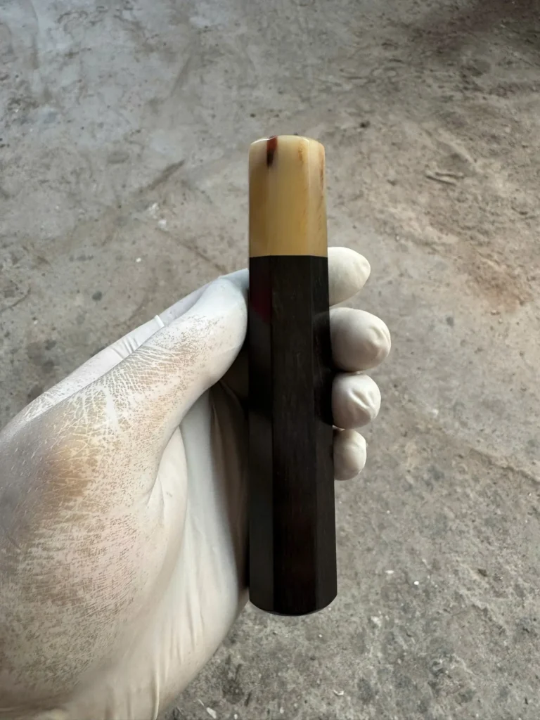 Ebony wa handle with white horn ferrule, photographed before shipping in October 2026