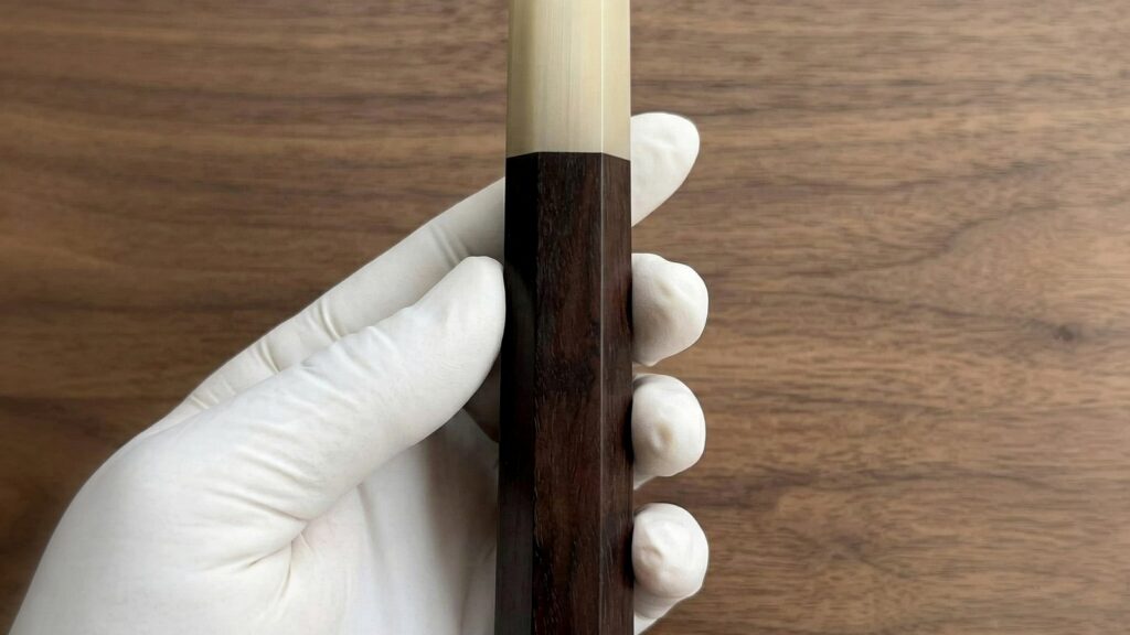 Dark ebony, blackwood, and wenge wa handle blanks on a walnut bench