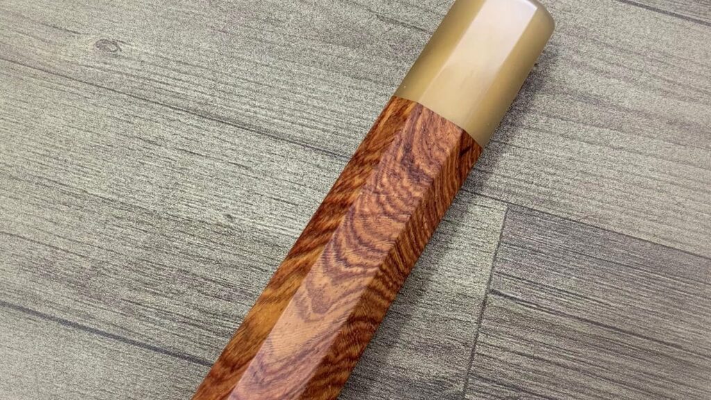 Padauk, rosewood, cherry, and red sandalwood tones in finished wa handles
