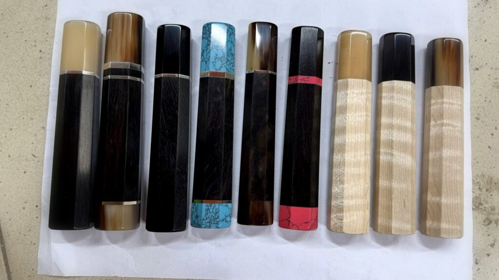 Dark and light wa handle woods arranged in two clean rows